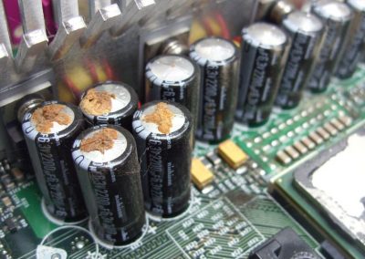 swollen_leaking_capacitors_motherboard